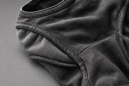 Close-up of the Deamon facemask’s stitched edges and textured grey fabric panels