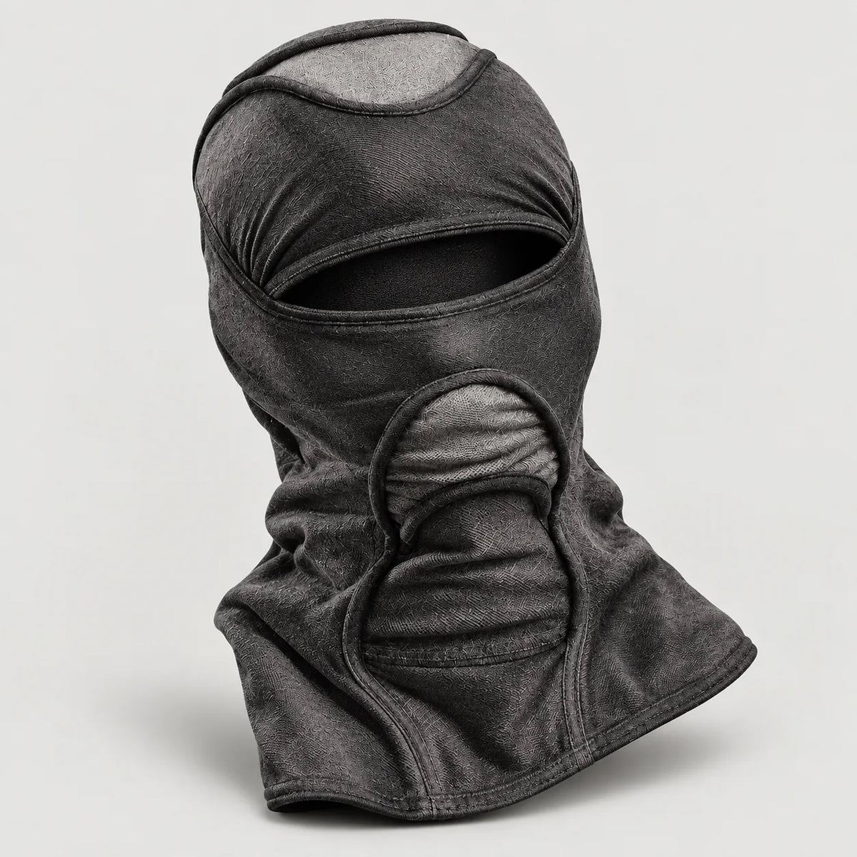 Grey and black Deamon facemask on a plain white background