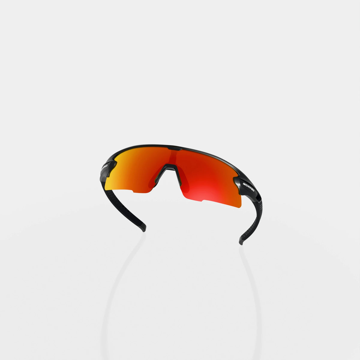 Strider Ember sunglasses from behind, showing the inside of the lens and curved frame on a pale studio background