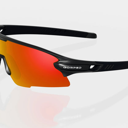 Strider Ember sunglasses with a close view of the GORPED logo and temple on a pale studio background