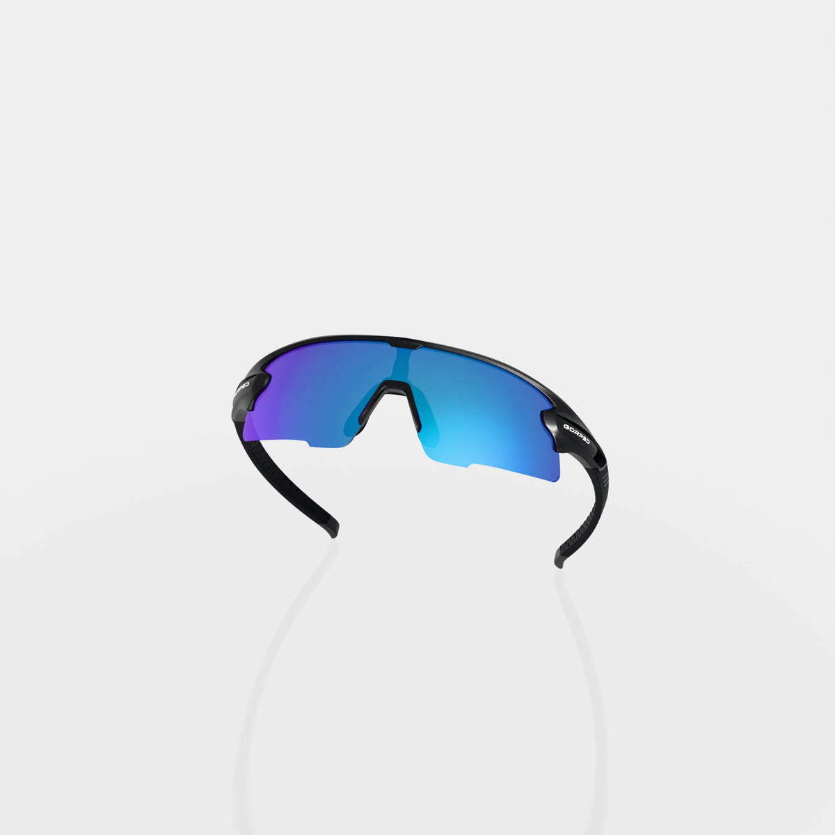 Strider Glacier sunglasses from behind, showing the inside of the lens and curved frame on a pale studio background