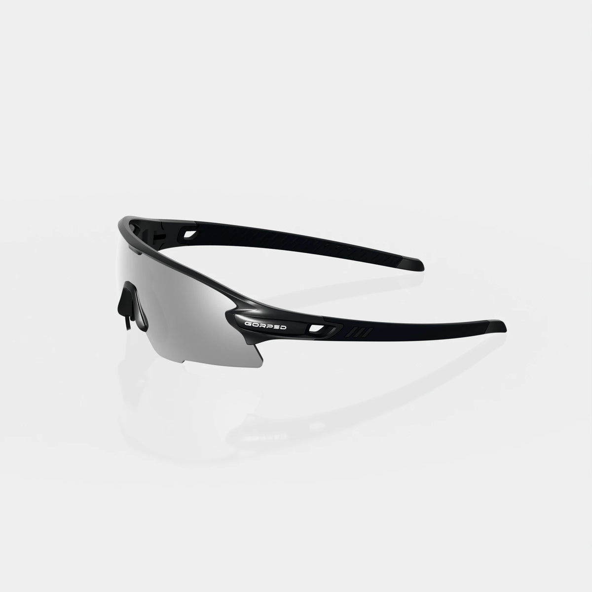 Strider Shadow sunglasses from the side, showing the open temples on a pale studio background