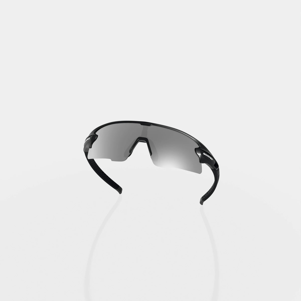 Strider Shadow sunglasses from behind, showing the inside of the lens and curved frame on a pale studio background