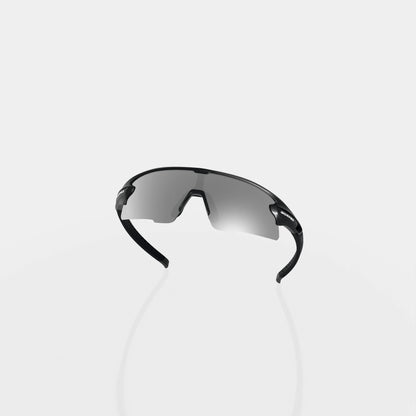 Strider Shadow sunglasses from behind, showing the inside of the lens and curved frame on a pale studio background